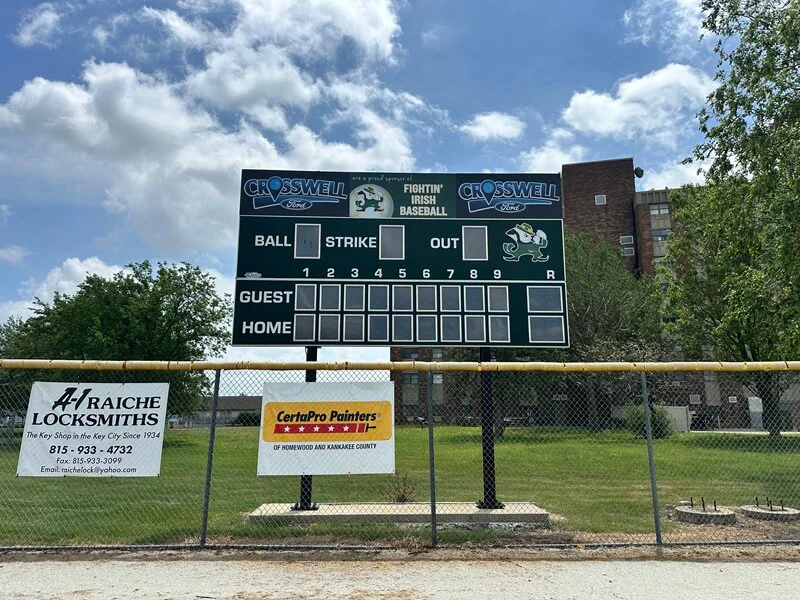 An image of the exterior signage along a fence.